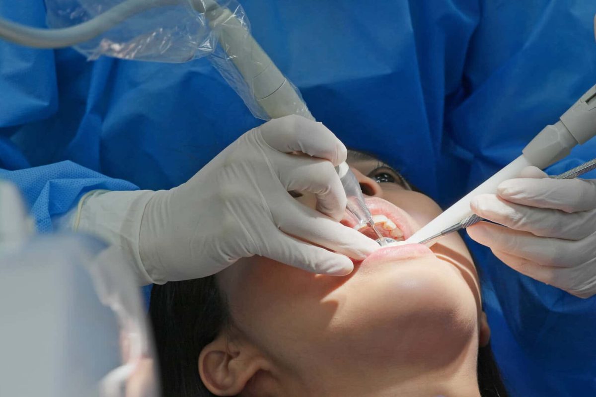 Woman undergo dental scaling treatment